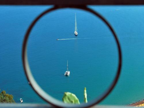 two boats in a large body of water at Golden Beach Inn in Chrysi Ammoudia
