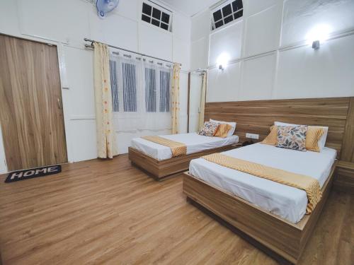 Postel nebo postele na pokoji v ubytování INSARA COTTAGE HOMESTAY