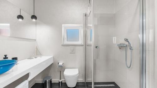 a white bathroom with a shower and a toilet at Villa Chic by Villas Holiday in Umag