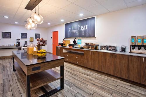 a large kitchen with a counter and a counter top at Hampton Inn & Suites Tampa East Casino Area in Seffner