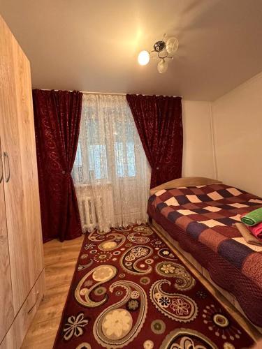Llit o llits en una habitació de Аппартаменты