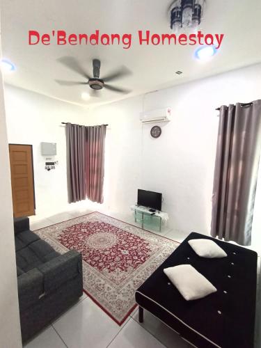 a living room with a couch and a table at De'Bendang Homestay Pendang in Pendang