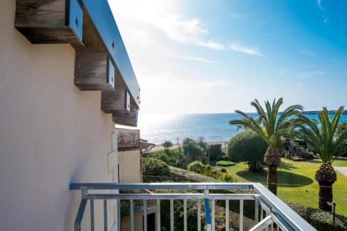 a balcony with a view of the ocean at Villa Donata Fontane Bianche in Fontane Bianche