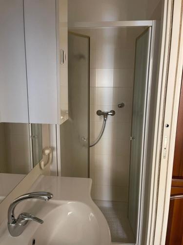 a bathroom with a shower and a white sink at Casa Carla … per le tue vacanze in Ventimiglia