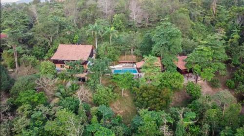 an aerial view of a house in the middle of a forest at De Serenity - Exclusive Jungle Retreat in Seremban
