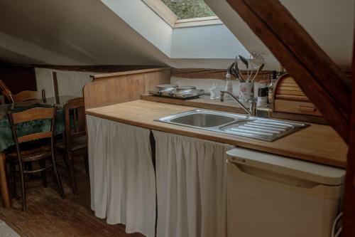 a kitchen with a sink and a counter top at Statek Veberovi in Semily