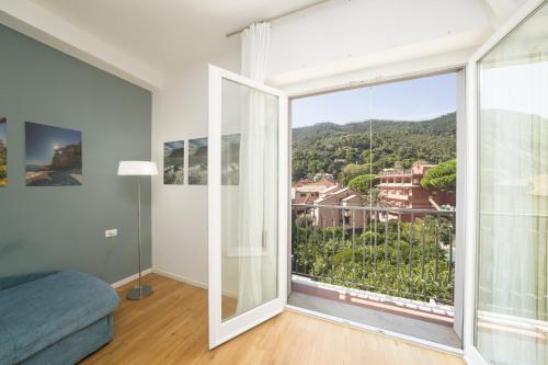 a room with a large window with a view at Poseidon Apartment 011019-LT-0180 in Monterosso al Mare