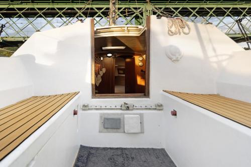 a bathroom on a boat with a mirror at Happy Sailor in Viana do Castelo