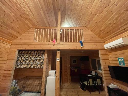an inside view of a wooden cabin with a wooden ceiling at Biwako Hills Resort - Vacation STAY 99556v in Takashima