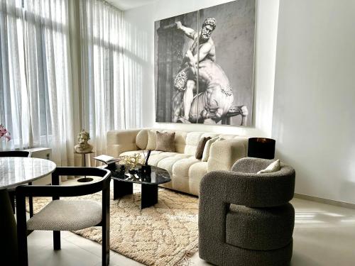 a living room with a couch and a chair at luxury in Mons