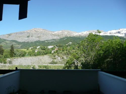 a balcony with a view of a mountain at Aurore 554 in Le Sauze
