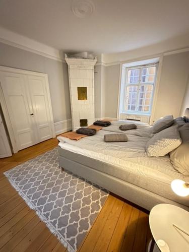 a bedroom with a large bed and a window at Gamla Stan in Stockholm