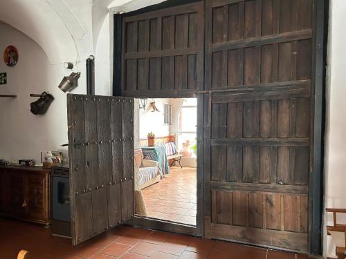 a sliding barn door in a living room at La Posá in La Nava de Santiago