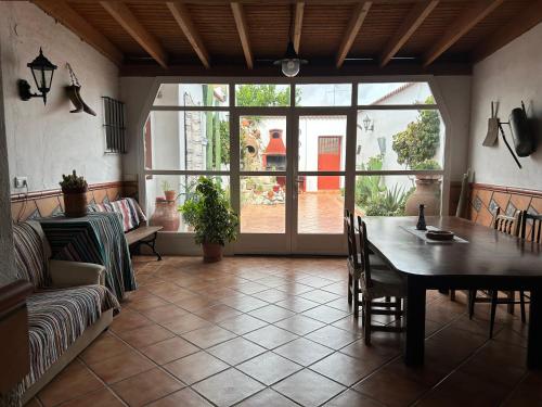 a large living room with a table and a couch at La Posá in La Nava de Santiago