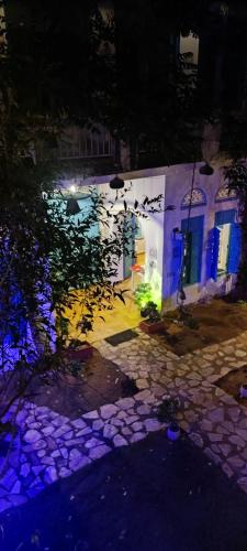 a white building with blue lights in front of it at the secret garden in Pushkar