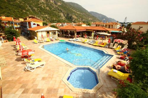 an overhead view of a swimming pool in a resort at Turk Hotel in Oludeniz