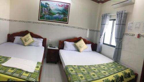 Katil atau katil-katil dalam bilik di Nhà Nghỉ Việt Thắng