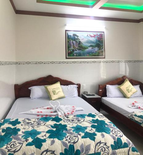 Katil atau katil-katil dalam bilik di Nhà Nghỉ Việt Thắng