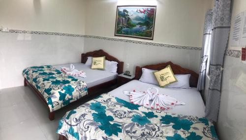 Katil atau katil-katil dalam bilik di Nhà Nghỉ Việt Thắng