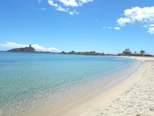 a view of the beach in front of the ocean at Casa Terra Del Sole in Pula