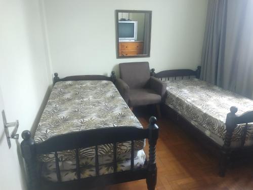 Кровать или кровати в номере Apartamento aconchegante no centro de Cabo Frio