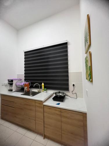 a kitchen with a sink and a window at SSR312/S2TOWN/3R2B HOMESTAY in Seremban