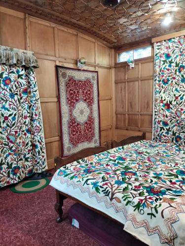 a bedroom with a bed and curtains in it at Honolulu Group Of Houseboats in Srinagar