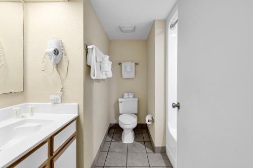 a bathroom with a toilet and a sink at Atlantica Beachfront Getaway in Myrtle Beach