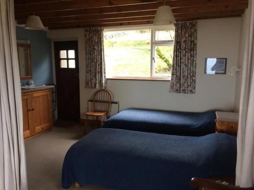 Katil atau katil-katil dalam bilik di Bryn Cottage