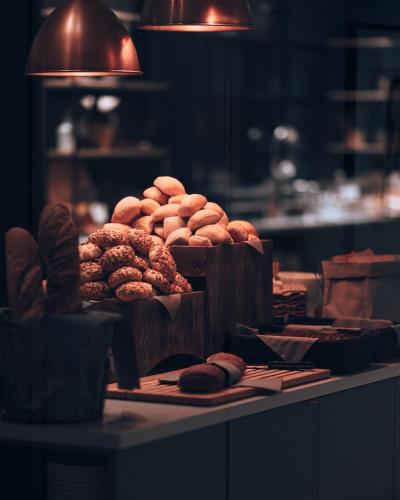 a table with two baskets of donuts and other foods at Clarion Hotel Stockholm in Stockholm