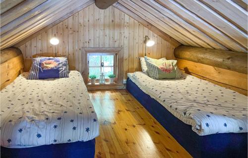 A bed or beds in a room at Awesome Home In Glava With Sauna