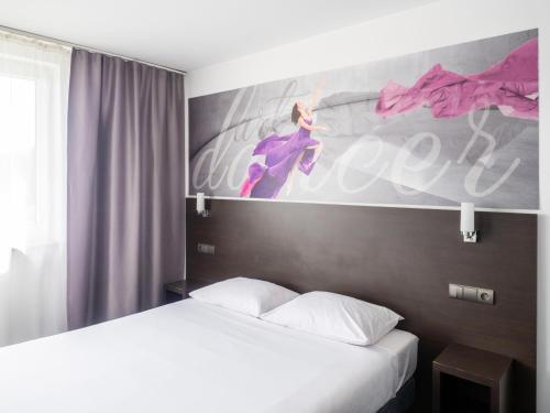 Postel nebo postele na pokoji v ubytování B&B HOTEL Bytom