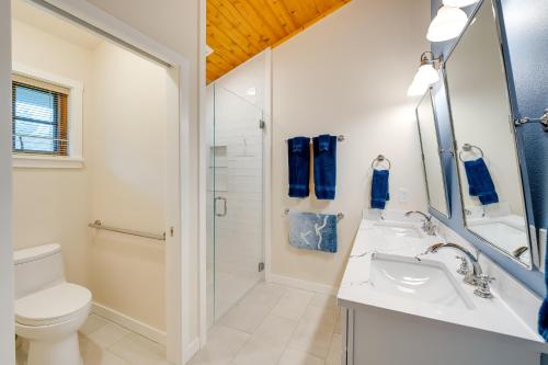 a bathroom with a toilet and a sink and a shower at Serene Island Retreat with Beach Access and Mtn Views! in Freeland