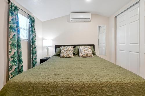 a bedroom with a large bed with two pillows at The Gateway Studio In the heart of Tampa in Tampa