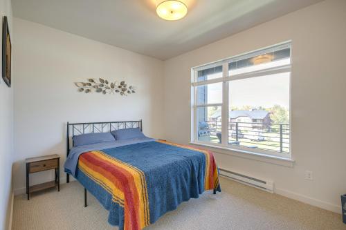 a bedroom with a bed and a window at Modern Livingston Condo Near Yellowstone River! in Livingston