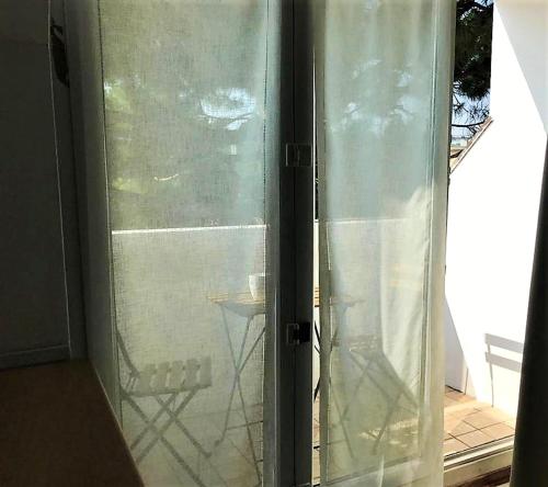 a sliding glass door with a view of a patio at Comfortable studio in Desenzano del Garda 47 m² with private balcony in Desenzano del Garda
