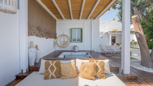 a patio with a hot tub on a house at villa lord in Pollonia