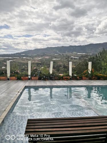 a swimming pool on the roof of a building at Amonitas Glamping Deluxe in Tinjacá