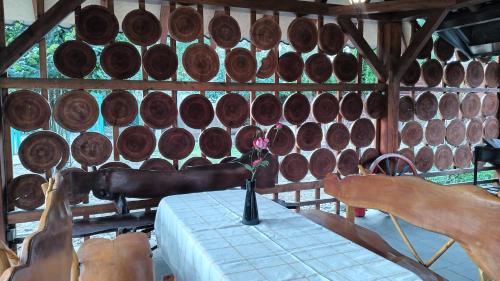 a room with a table with a bunch of wine barrels at Ardilla in Lhota