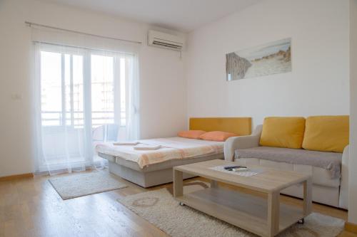 Ένα ή περισσότερα κρεβάτια σε δωμάτιο στο City kvart na dan