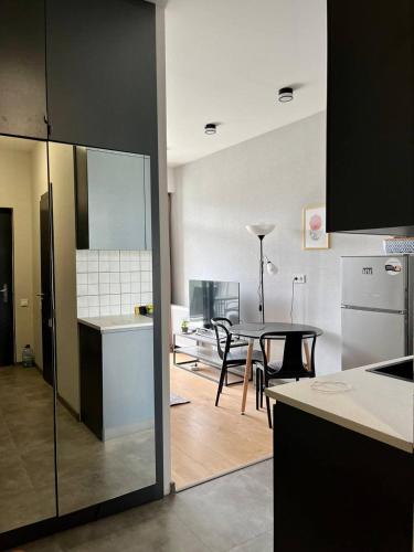 a kitchen and a dining room with a table in a kitchen at Graz Narek house 2 in Altenfelden