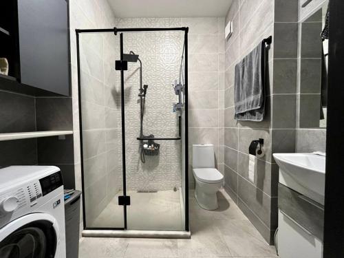 a bathroom with a shower with a toilet and a sink at Graz Narek house 2 in Altenfelden