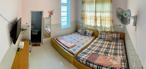 Giường trong phòng chung tại Homestay VT