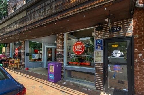a store front of a brick building with a stop sign at Cherry Street Loft (A) Pet-Friendly & In the Heart of Downtown Black Mtn! in Black Mountain