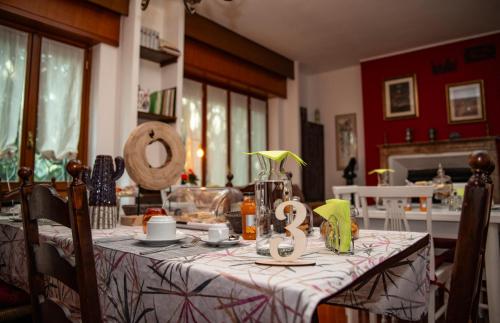 a dining room table with a table cloth on it at La Corte di Aldo in Rozzano
