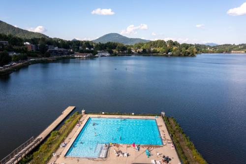 an overhead view of a swimming pool on a lake at Lower Lakeshore Living in Lake Junaluska