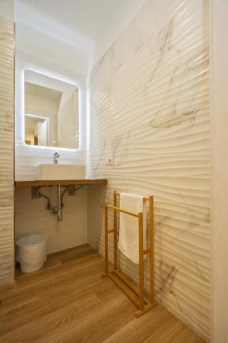 a bathroom with a sink and a mirror at infinity Castellabate b & b di Charme in Santa Maria di Castellabate