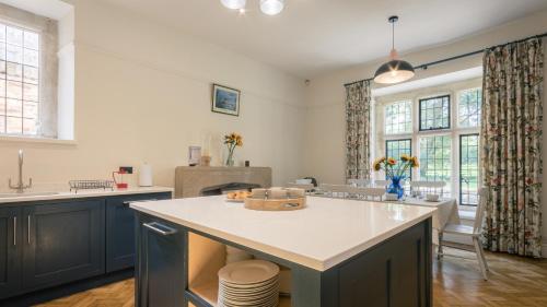 a kitchen with a large island in the middle at Grand Manor House Bristol-Celebrations Events Hens - Simply Check In in Bristol