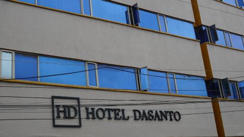 a hotel building with a sign on the side of it at HOTEL DASANTO HD in Barranquilla
