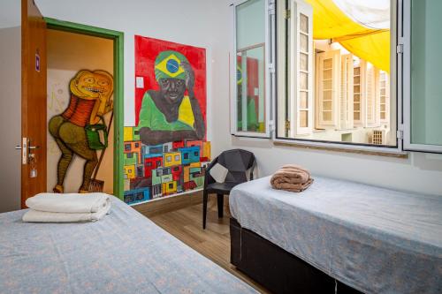Ένα ή περισσότερα κρεβάτια σε δωμάτιο στο Books Hostel